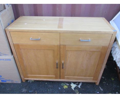 A modern light oak side cabinet having two drawers and two cupboard doors below, 35 1/2 h x 46 1/2w