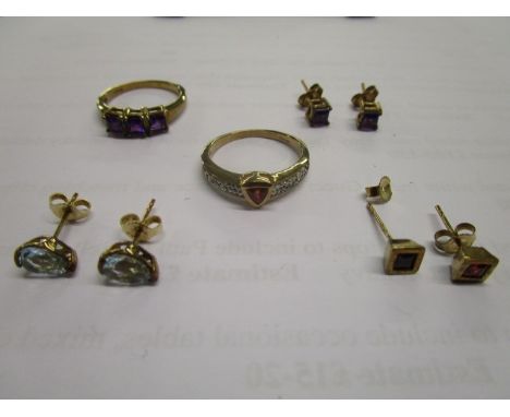 A 9ct yellow gold amethyst ring, a 9ct ruby and diamond set ring and three pairs of 9ct gold gem set stud earrings to include