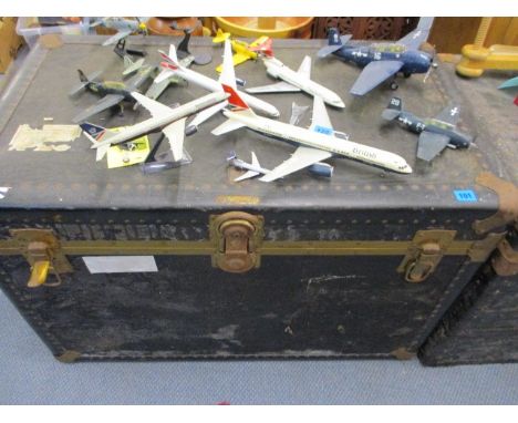 A large Edwardian metal bound travel trunk with leather carrying handles, 24 x 36 1/2