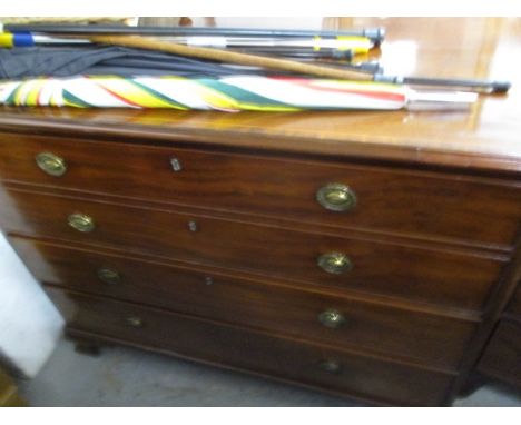 An early 19th century string inlaid mahogany three-drawer dressing chest with a facsimile drawer, raised on ogee bracket feet
