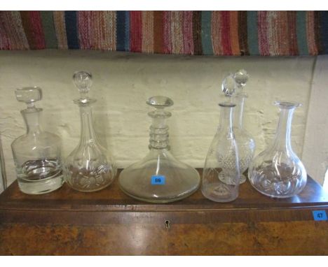 A modern ships decanter and five others