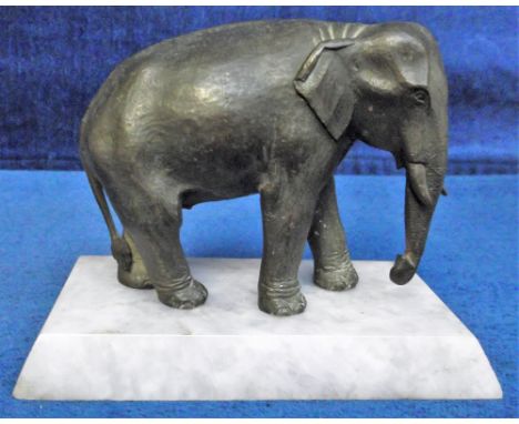 Collectables, Vintage bronze elephant on pale grey marble plinth. Approx 11 cms tall. Small crack across top of tail o/w gd (