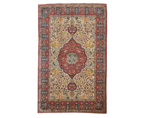 TABRIZ 'HUNTING' CARPET NORTHWEST PERSIA, EARLY/MID 20TH CENTURY the cream field with red medallion suspending pendants, with