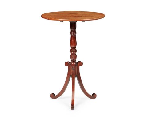 REGENCY MAHOGANY TRIPOD TABLE  EARLY 19TH CENTURY the circular tilt top on a ring-turned baluster support and scrolled tripod