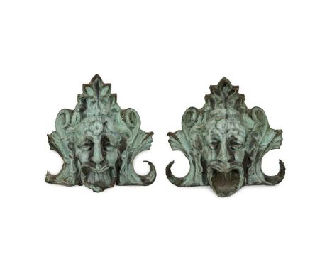 PAIR OF LARGE COPPER ARCHITECTURAL ORNAMENTS  19TH CENTURY  depicting a pair of Greco-Roman style grotesque theatre masksDime