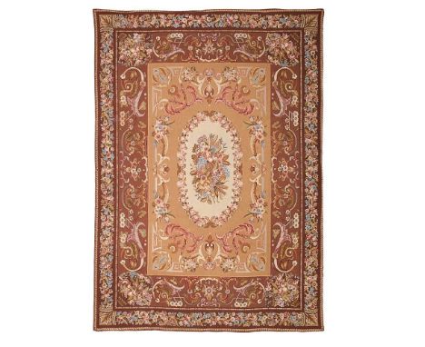 AUBUSSON STYLE NEEDLEWORK CARPET MODERN the light brown field with cream floral and fruiting medallion, within two brown bord