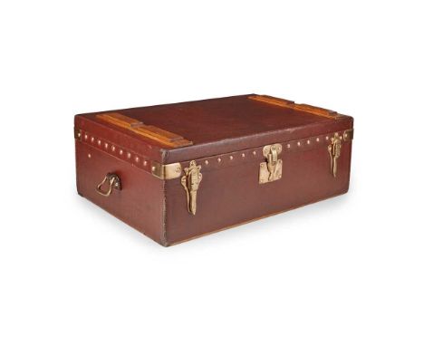 LOUIS VUITTON MOTORING TRUNK CIRCA 1910 burgundy Vuittonite exterior, with central brass lock and two catches, with brass loo