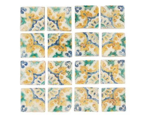 COLLECTION OF SPANISH POLYCHROME TILES 17TH/ 18TH CENTURY comprising sixteen tiles which form four four-tile panels with a re