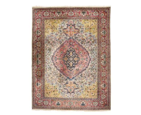 TABRIZ CARPET, SIGNED ASHAARI NORTHWEST PERSIA, MID 20TH CENTURY the pale blue field with light red and indigo medallion, oli