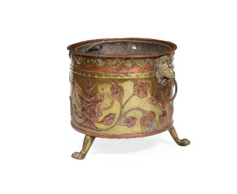 DUTCH BRASS AND COPPER LOG BUCKET 19TH CENTURY the exterior with applied leaf motifs and lion mask ring handles, raised on pa