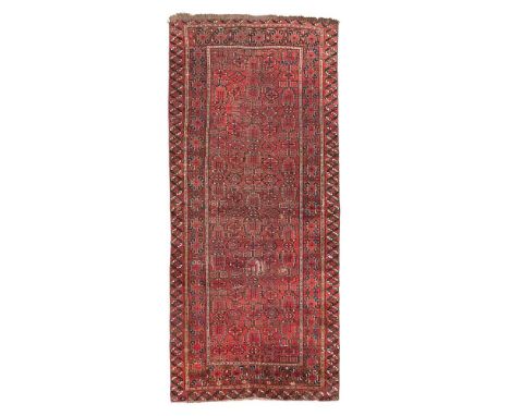 BESHIR CARPET TURKMENISTAN, LATE 19TH/EARLY 20TH CENTURY the red field with allover stylised foliate pattern, within red bord