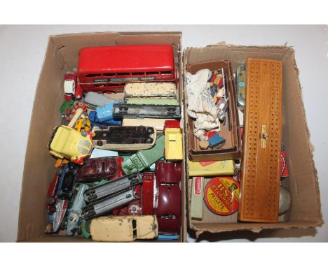Two boxes containing vintage toys, including Dinky die cast vehicles 