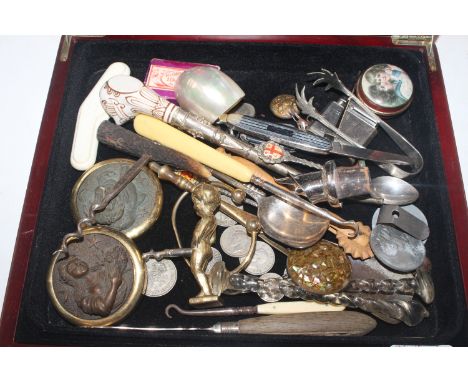 A box of small sundry items including paperweights, corkscrews, cigarette lighter, coins etc.