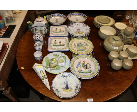A collection of various Quimper pottery items