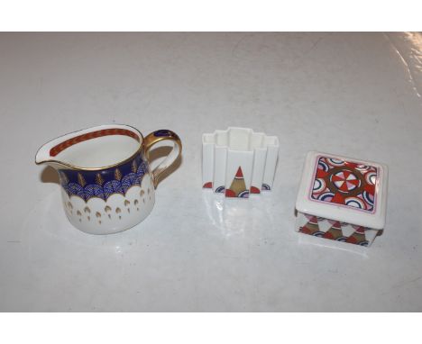 A Royal Crown Derby "Quail" pattern cream jug; a Poole porcelain box and cover and matching vase