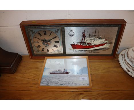 An HMS Endurance mantel clock and a photograph of HMS Endurance, at sea in the Arctic