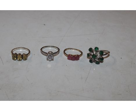 Four Sterling silver gem set rings including ruby and citrine, sizes R, O, N, and L