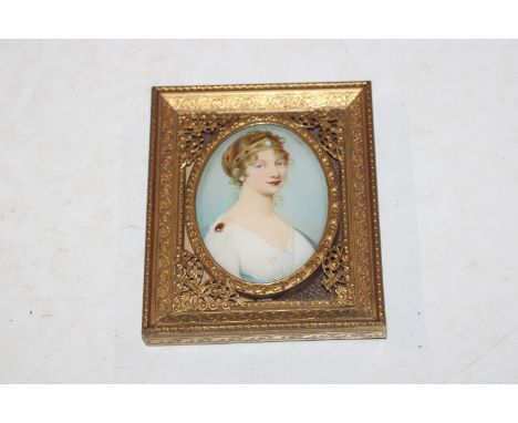 A miniature portrait contained in ornate gilt frame 