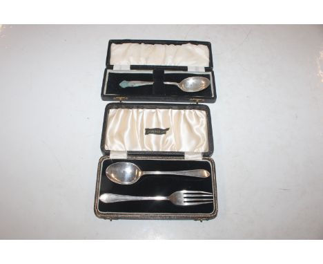 A cased silver fork and spoon and cased silver spoon, approx. total weight 2oz (79gms)