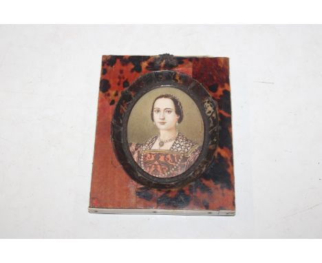 An oval miniature portrait contained in tortoiseshell mounted frame 