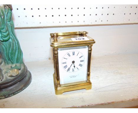 A brass carriage clock by Fisher and Co. 1885