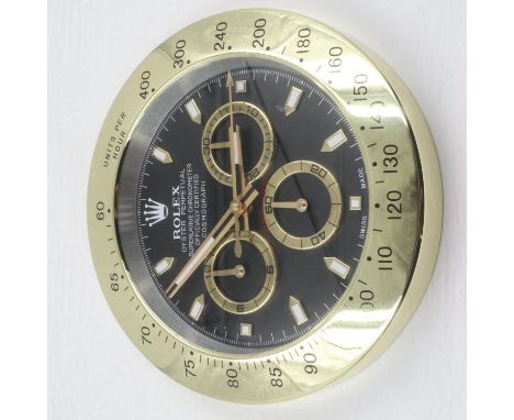Dealers wall clock with Daytona black and gold dial and sweeping seconds hand, D: 34cm. P&amp;P Group 2 (£18+VAT for the firs