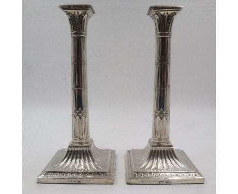 Pair of hallmarked silver Doric candlesticks, weighted, H: 28 cm, maker James Dixon and Sons. UK P&amp;P Group 2 (£20+VAT for