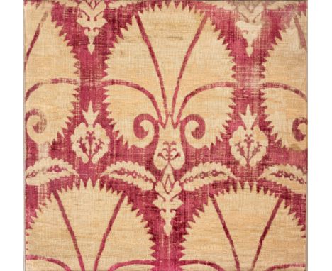 AN OTTOMAN SILK VELVET (CATMA) PANEL, BURSA, ANATOLIA, CIRCA 1600 with repeated design of stylised carnations, growing from t