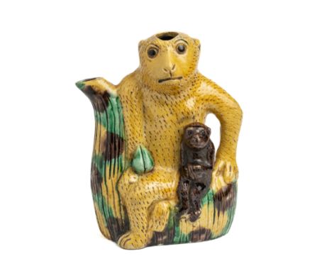 A CHINESE SANCAI 'MONKEY' EWER, 19TH CENTURY seated on a stylised tree trunk forming the spout and with a small monkey perche
