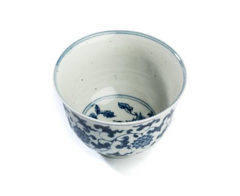 A CHINESE BLUE AND WHITE 'LOTUS' BOWL, 19TH CENTURY painted around the exterior of the deep U-shaped body with a leafy lotus 