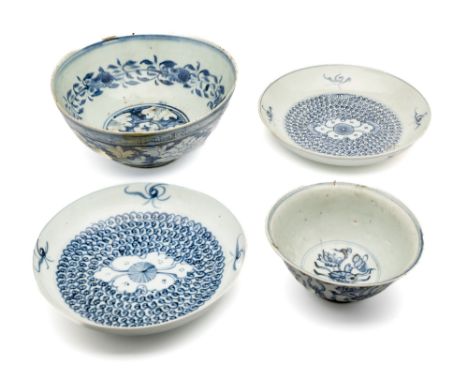 A LARGE CHINESE BLUE AND WHITE ‘PEONY SCROLL’ BOWL, MING DYNASTY the deep rounded sides rising from a short straight foot, pa
