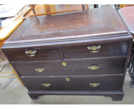 A mid 18th century mahogany chest, the moulded caddy top above two short and two long drawers on bracket feet