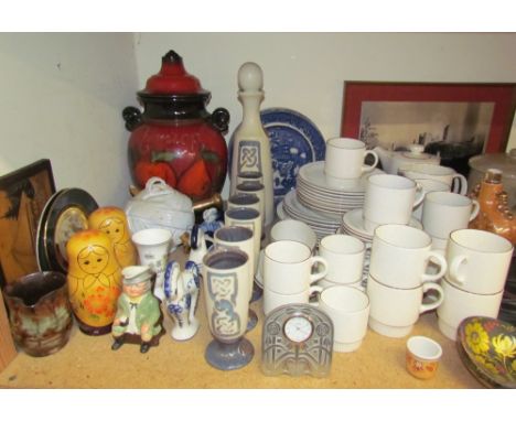 A Poole pottery part coffee and dinner set together with a studio pottery decanter and goblets, Russian dolls, cameras, clock