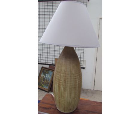 A studio pottery table lamp, with a tapering cylindrical body  