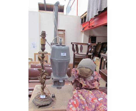 A gilt metal candlestick table lamp together with a developer and a doll