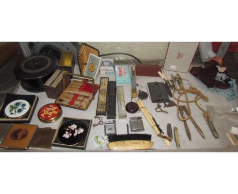 A puppet, together with compacts, razors etc