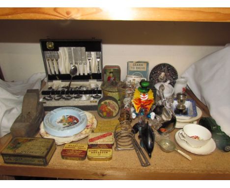 A Poole pottery dolphin together with a Murano glass clown, tins, plane, part flatware service, commemorative wares etc