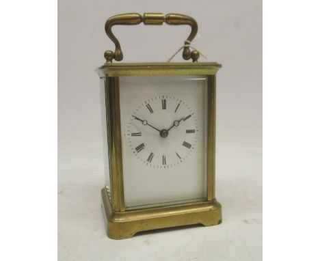 Early 20th Century French carriage clock timepiece, brass case, bevel edged glass panels, white enamel Roman dial, platform c