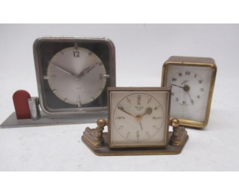 Kienzle 8 day brass brass alarm clock supported by two sealions, 2" silvered dial with Arabic and baton indices, H6cm; Art De