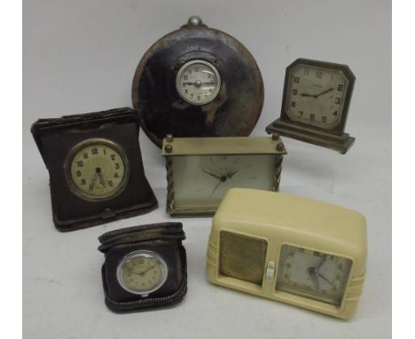 Simplex aluminium nightwatchman's clock in leather case, signed silvered Arabic dial, lacking keys, D15cm; other clocks; alar