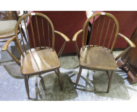 Pair of Ercol stick back open armchairs, backs stamped  F.182, 290, (2)
