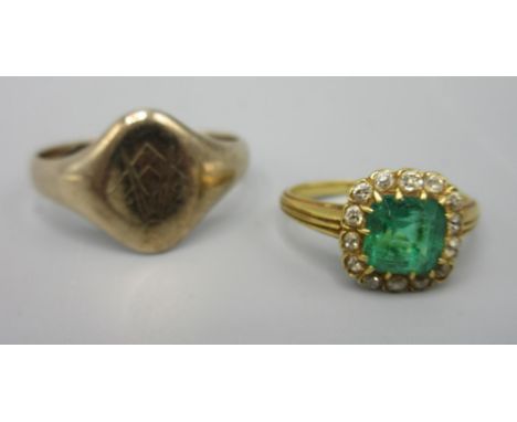 Yellow metal ring set with emerald with diamond border, size K, and a yellow metal signet ring with masonic crest, size U, 7.