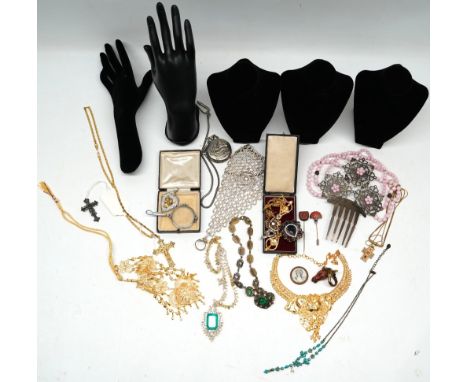 Silver gilt pendant set with large emerald and clear stones, stamped 925, on unmarked chain, a large metal hair comb,  a lion