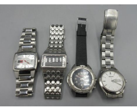 Seiko stainless steel quartz wristwatch with day date, signed white dial, baton indices, centre seconds, signed screw on case