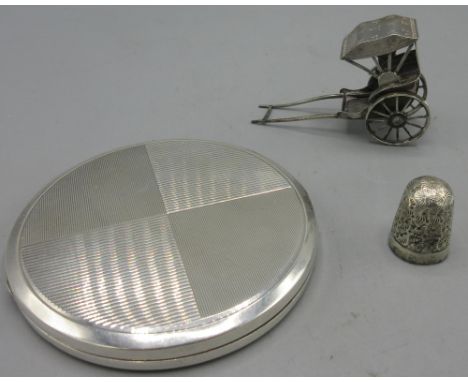 Miniature Chinese silver rickshaw, stamped WH90, silver powder compact with engine turned pattern, stamped 925, and a silver 