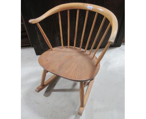Ercol light elm stick back low rocking armchair