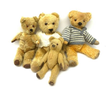 Four 1950s English teddy bears including Chad Valley bear with swivel jointed head, glass type eyes, vertically stitched nose