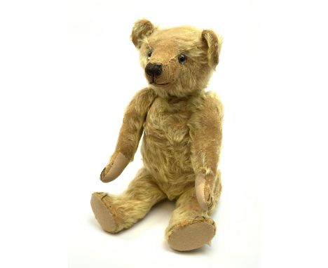 1930s teddy bear, possibly Farnell, with wood wool filled blond mohair body, the revolving head with original clear glass eye