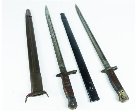 A British 1907 pattern Wilkinson Bayonet made in June 1917 with metal scabbard (blade length 43cm)  together with an American