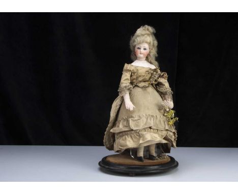 A rare 19th century French pressed bisque swivel head fashionable doll bonbonniere,  with fixed grey/blue glass eyes, darker 